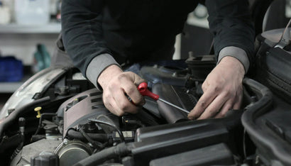 Man repairing car engine